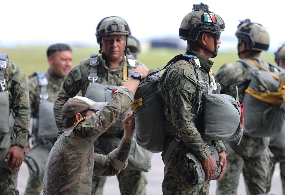 Service members of Belize, Mexico, Guyana, France, and U.S. train in airborne based operations.