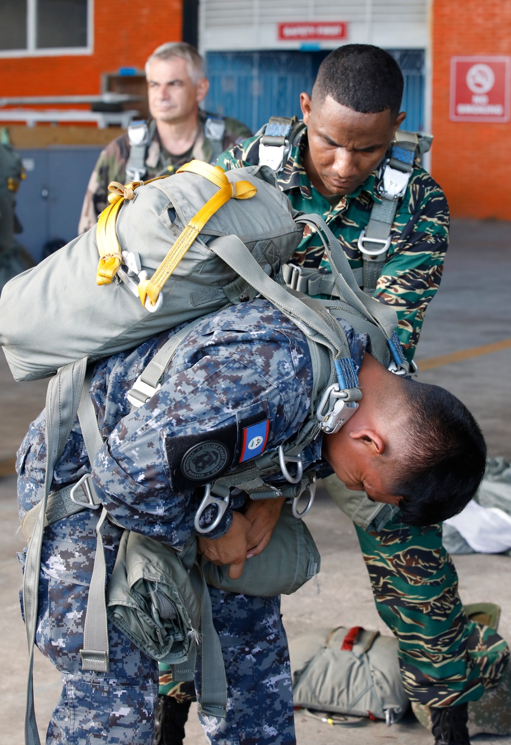 Service members of Belize, Mexico, Guyana, France, and U.S. train in airborne based operations.