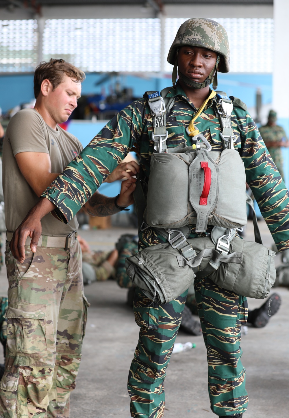 Service members of Belize, Mexico, Guyana, France, and U.S. train in airborne based operations.