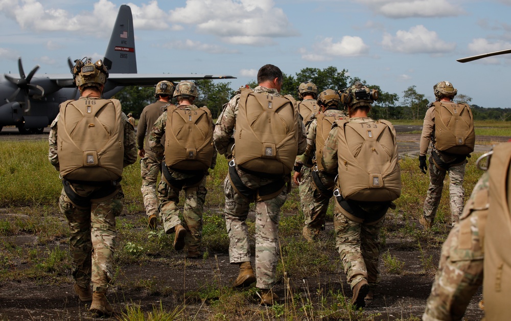 Service members of Belize, Mexico, Guyana, France, and U.S. train in airborne based operations.