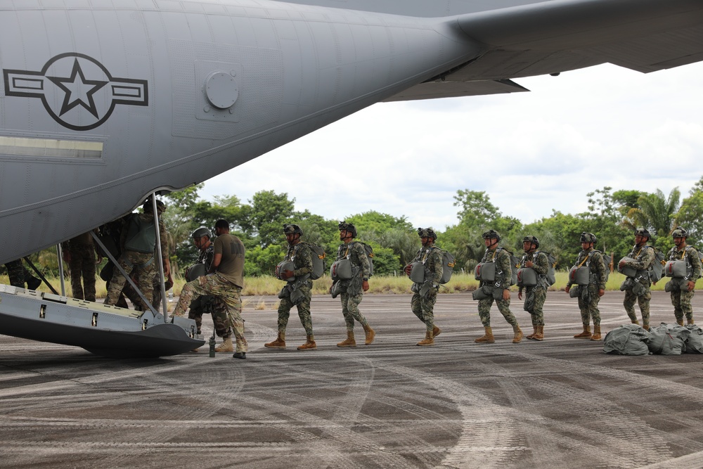 Service members of Belize, Mexico, Guyana, France, and U.S. train in airborne based operations.