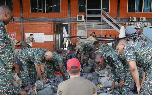 Service members of Belize, Mexico, Guyana, France, and U.S. train in airborne based operations.