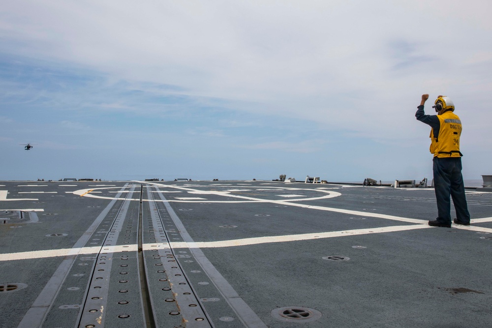 USS Ralph Johnson Sailors conduct flight quarters in the Sea of Japan.