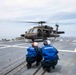 USS Ralph Johnson Sailors conduct flight quarters in the Sea of Japan.