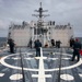 Crash and salvage team members train by fighting a simulated fire aboard USS Ralph Johnson.