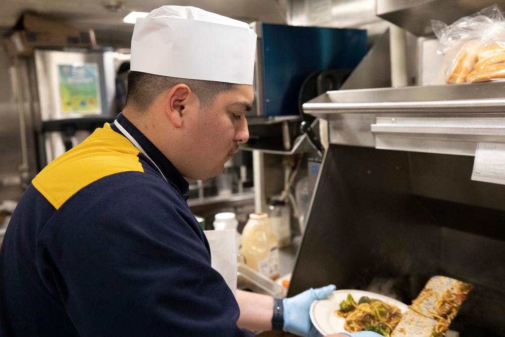 USS Princeton Sailors Cook Dinner