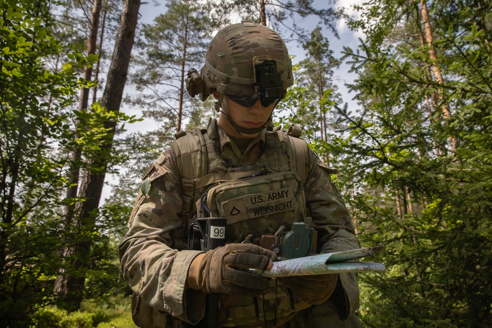 U.S. Army Soldier Utilizes Compass for Land Navigation