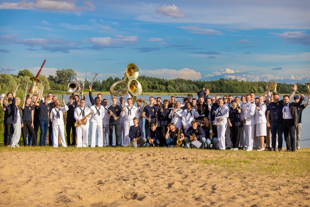 U.S. Marines and sailors with U.S. Naval Forces Europe and Africa perform at Vilkaviskis, Lithuania