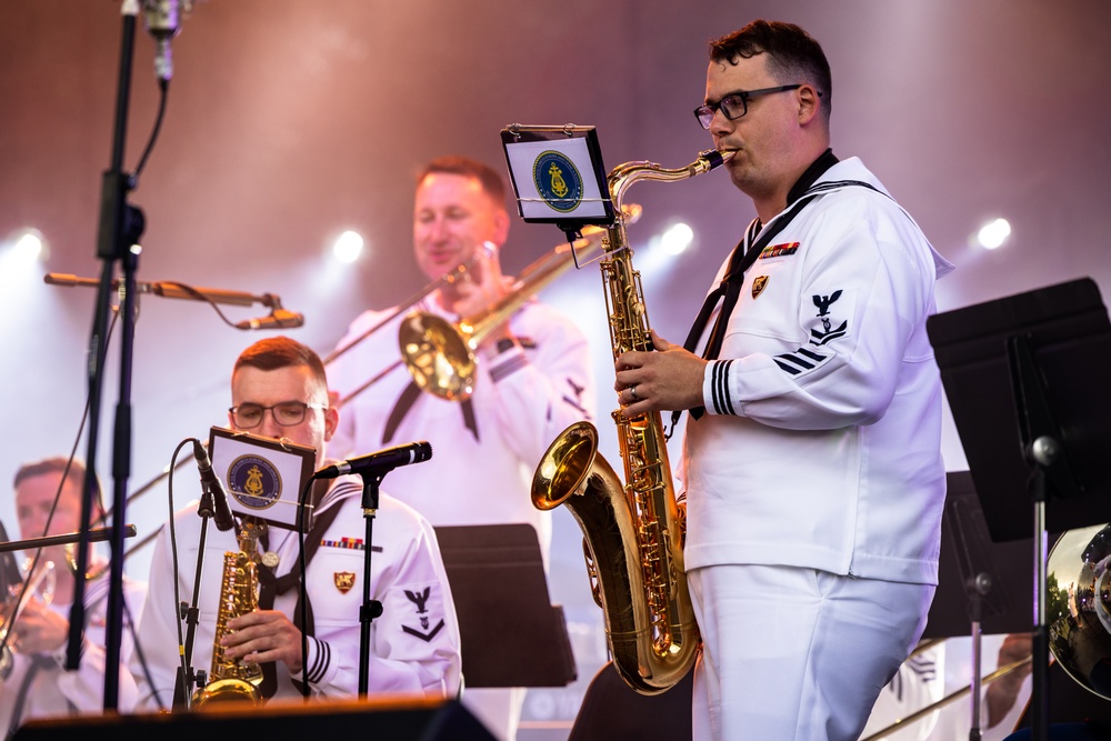 U.S. Marines and sailors with U.S. Naval Forces Europe and Africa perform at Vilkaviskis, Lithuania