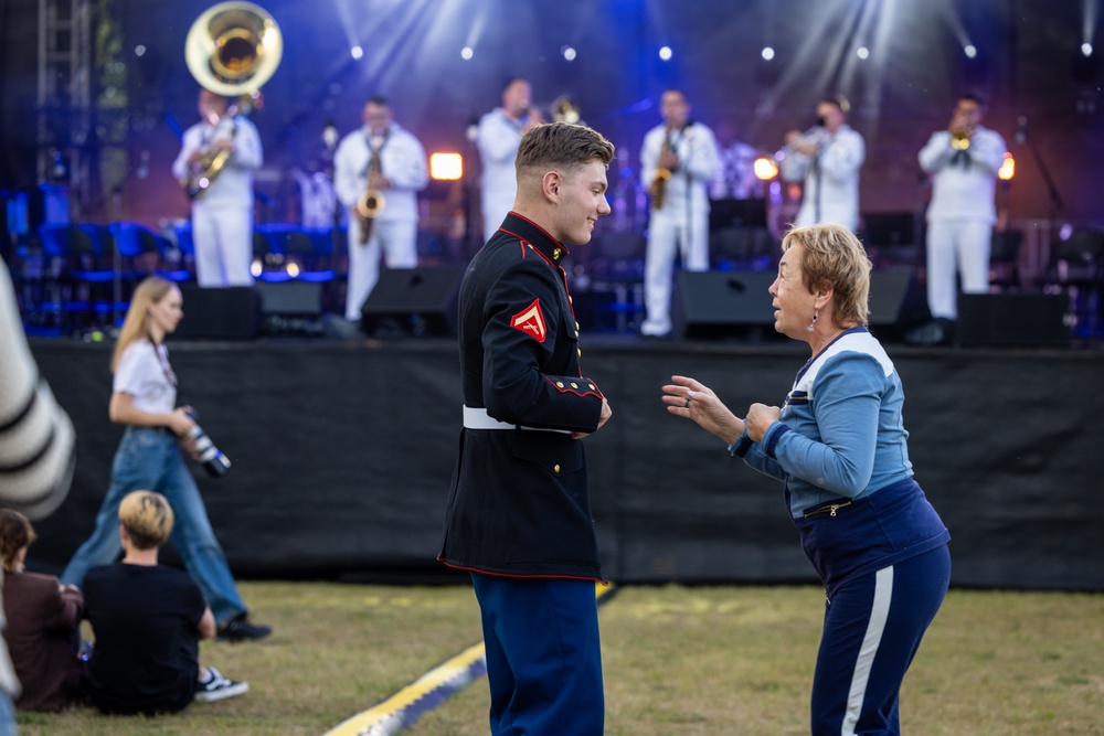 U.S. Marines and sailors with U.S. Naval Forces Europe and Africa perform at Vilkaviskis, Lithuania