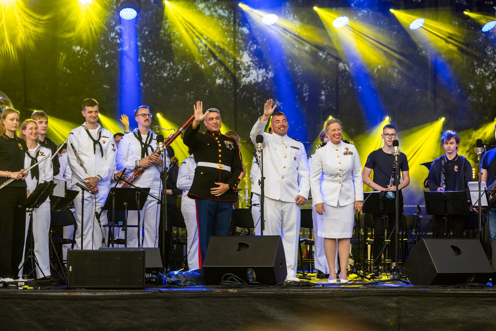 U.S. Marines and sailors with U.S. Naval Forces Europe and Africa perform at Vilkaviskis, Lithuania