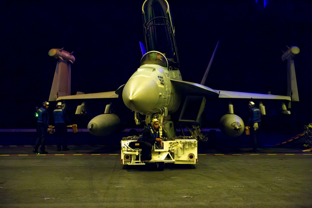 USS Carl Vinson (CVN 70) Sailors Move Aircraft