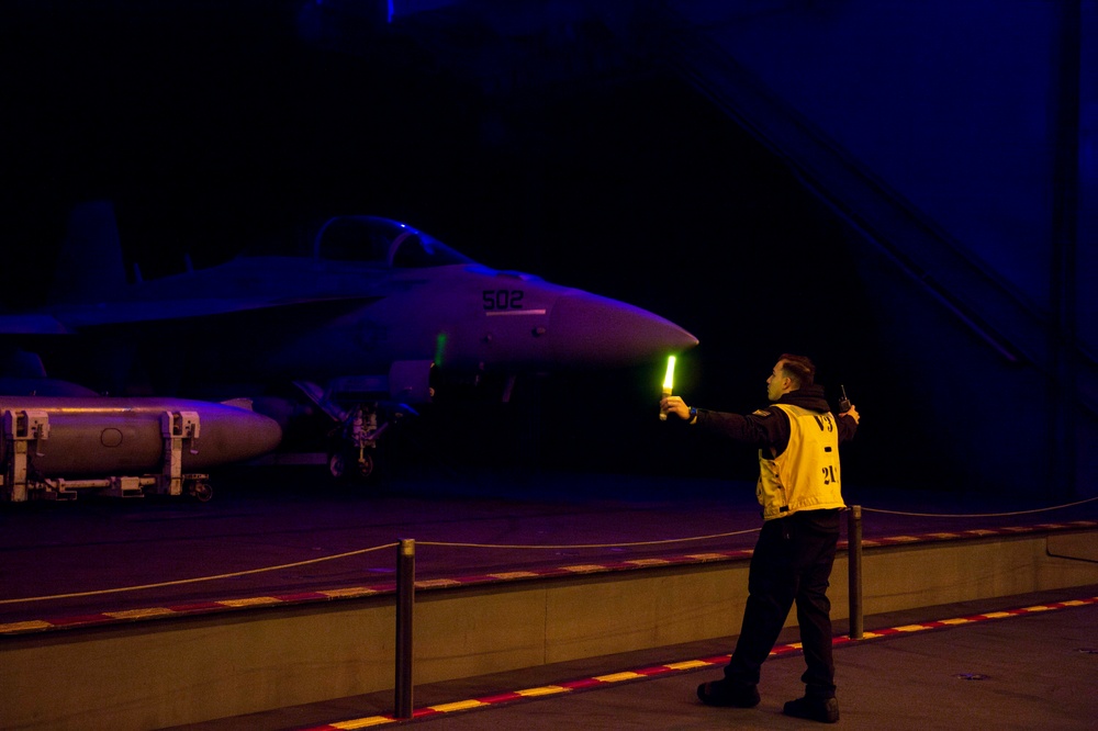 USS Carl Vinson (CVN 70) Sailors Move Aircraft