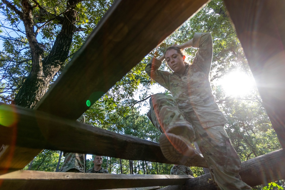 Army Staff Sgt. Erin Mackinnon completes the hurdles obstacle