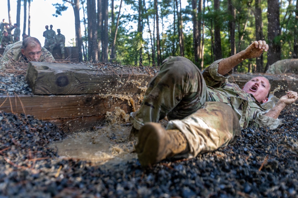 Army Sgt. 1st Class Jennifer Riley completes the Fit to Win obstacle course