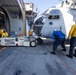 USS Bataan Sailors move an aircraft