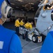 USS Bataan Sailors move an aircraft