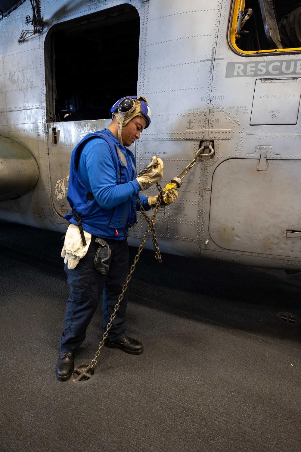 USS Bataan Sailors move an aircraft