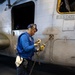 USS Bataan Sailors move an aircraft