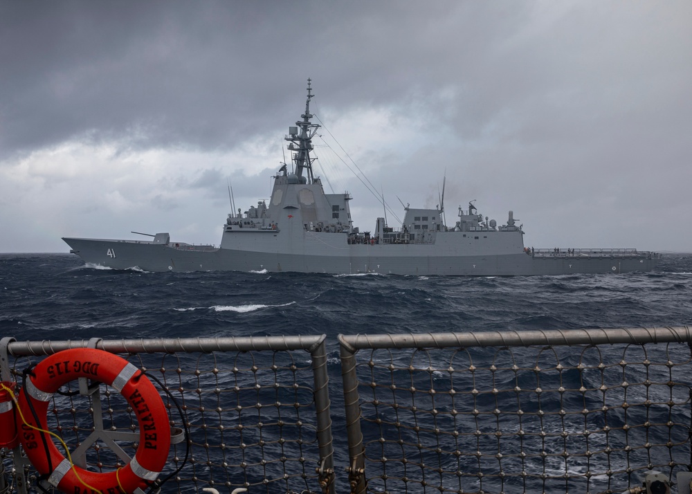 USS Rafael Peralta (DDG 115) conducts a personnel transfer with the Royal Australian Navy Hobart-class destroyer HMAS Brisbane (DDG 41)