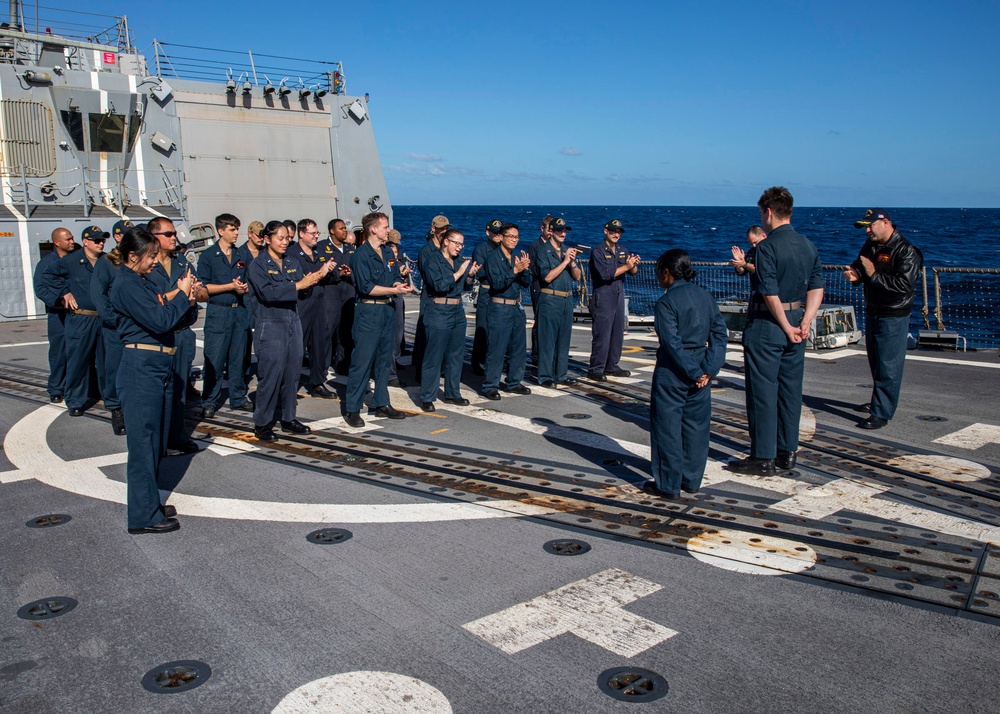 USS Rafael Peralta (DDG 115) conducts a SWO pinning on the flight deck