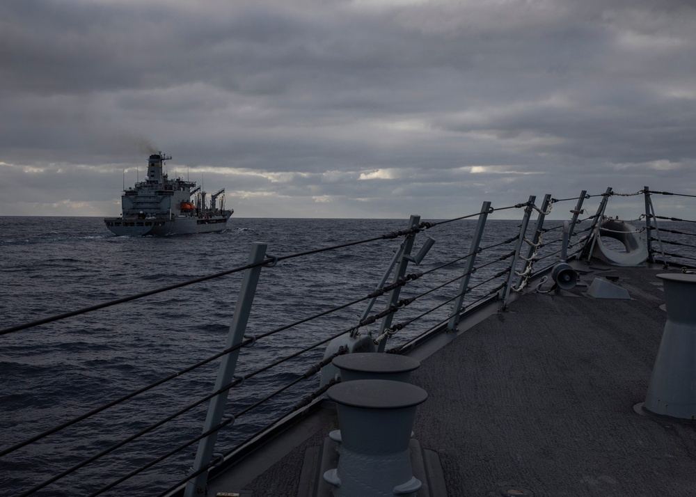 USS Rafael Peralta (DDG 115) conducts a replenishment-at-sea with the Military Sealift Command fleet replenishment oiler USNS Tippecanoe (T-AO 199)