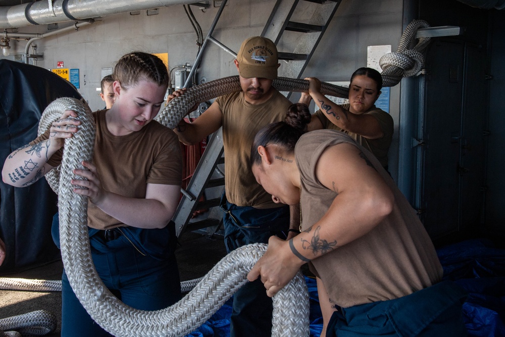 USS Ronald Reagan (CVN 76) Sailors splice line