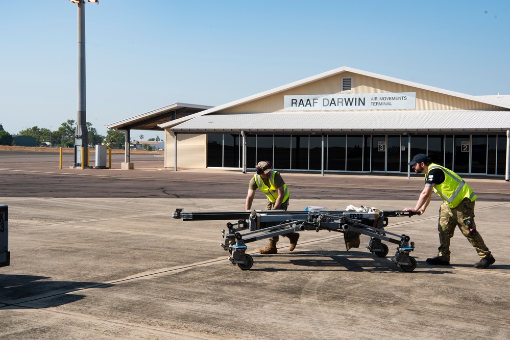 Combined members load, transport Airmen for Talisman Sabre 23