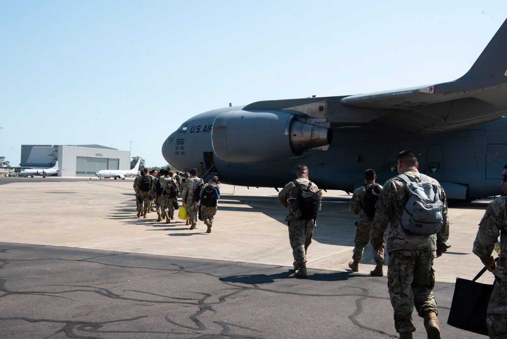 Combined members load, transport Airmen for Talisman Sabre 23