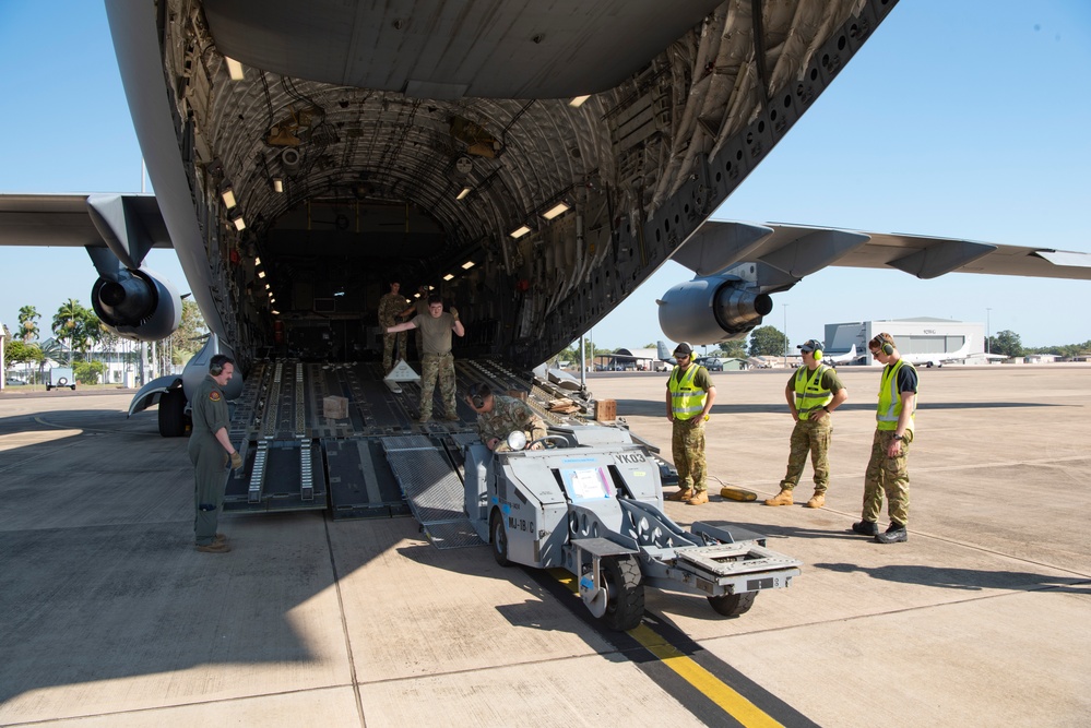 Combined members load, transport Airmen for Talisman Sabre 23