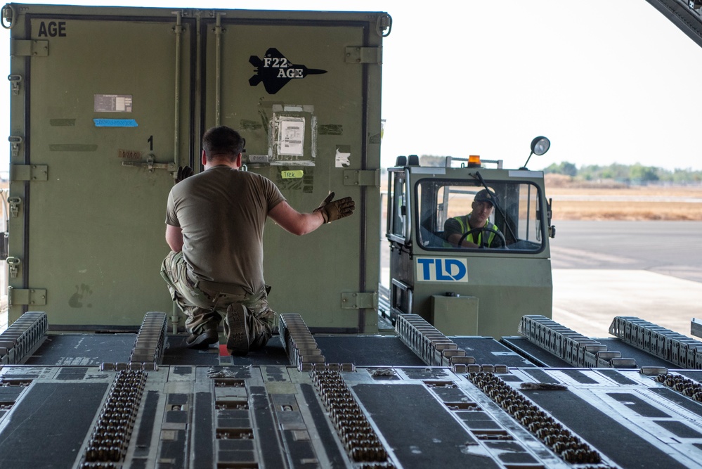 Combined members load, transport Airmen for Talisman Sabre 23