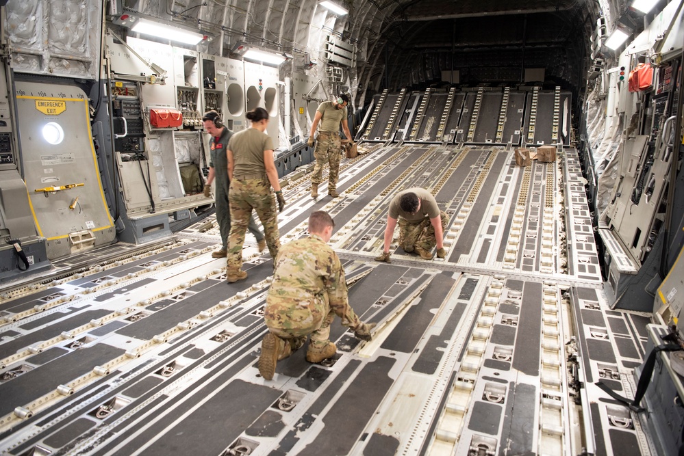 Combined members load, transport Airmen for Talisman Sabre 23