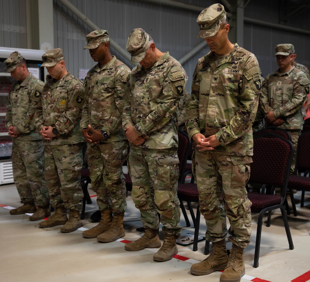 Key leadership takes a moment to pray.