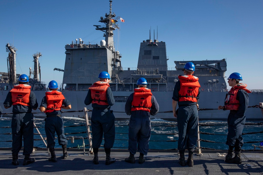 USS Ralph Johnson conducts a replenishment-at-sea with the Japan Maritime Self-Defense Force ship JS Mashu.