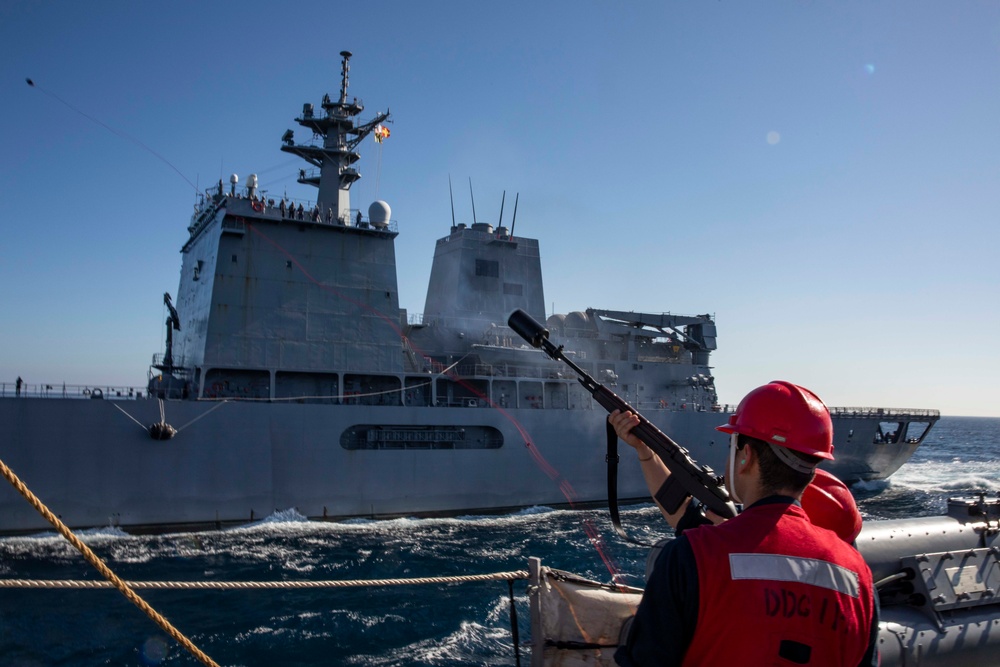 USS Ralph Johnson conducts a replenishment-at-sea with the Japan Maritime Self-Defense Force ship JS Mashu.