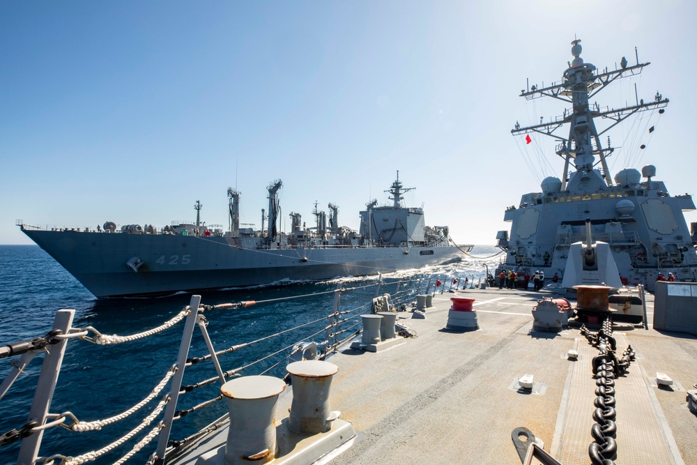 USS Ralph Johnson conducts a replenishment-at-sea with the Japan Maritime Self-Defense Force ship JS Mashu.