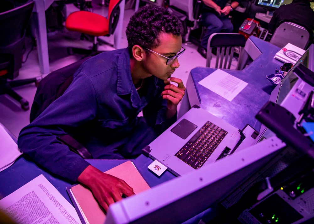 Sailors Stand Watch in the Combat Information Center aboard USS John Finn (DDG 113)