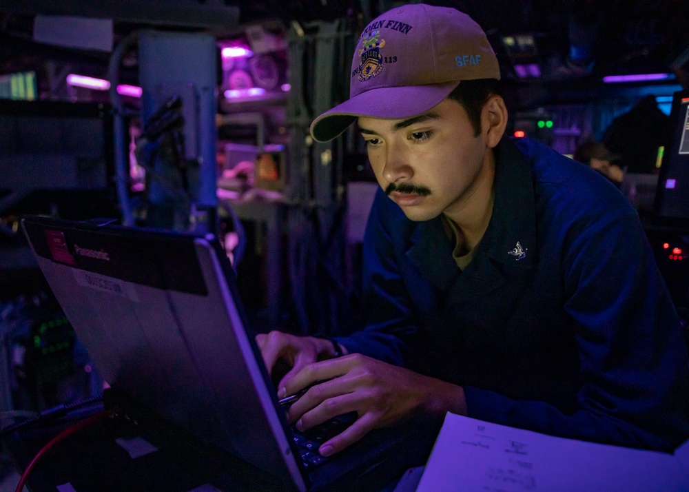 Sailors Stand Watch in the Combat Information Center aboard USS John Finn (DDG 113)