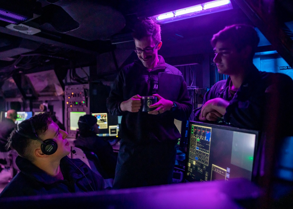 Sailors Stand Watch in the Combat Information Center aboard USS John Finn (DDG 113)