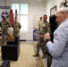 USAREUR-AF Command Sgt. Maj. Jeremiah Inman coins Soldiers at USAG-Poland