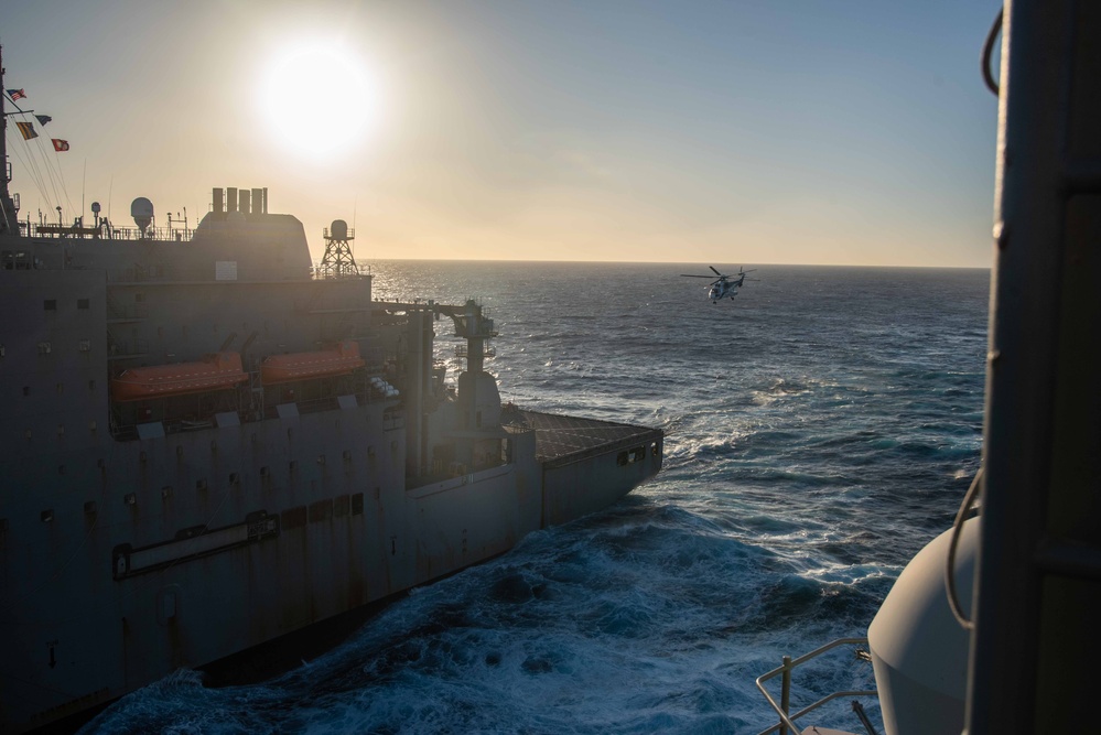 USS Ronald Reagan (CVN 76) conducts vertical replenishment-at-sea with USNS Carl Brashear (T-AKE 7)