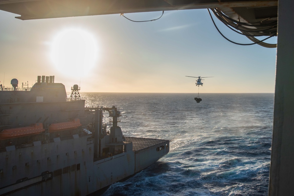 USS Ronald Reagan (CVN 76) conducts vertical replenishment-at-sea with USNS Carl Brashear (T-AKE 7)