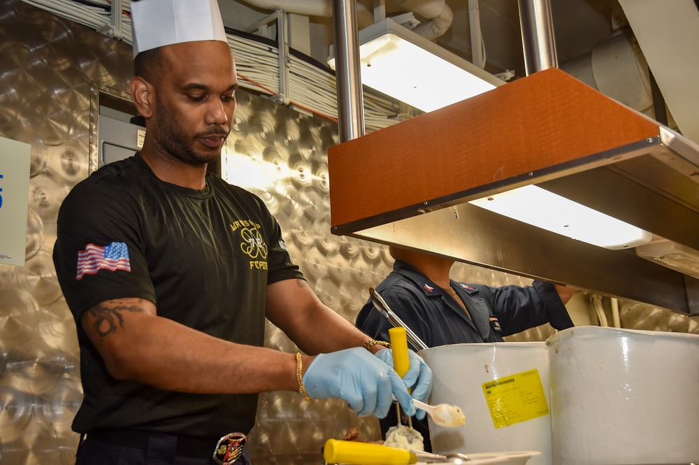 USS Ronald Reagan (CVN 76) Sailors serve Brunch