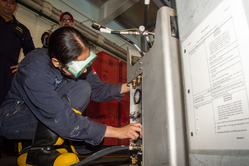 USS Ronald Reagan (CVN 76) Sailors conducts flying squad drills