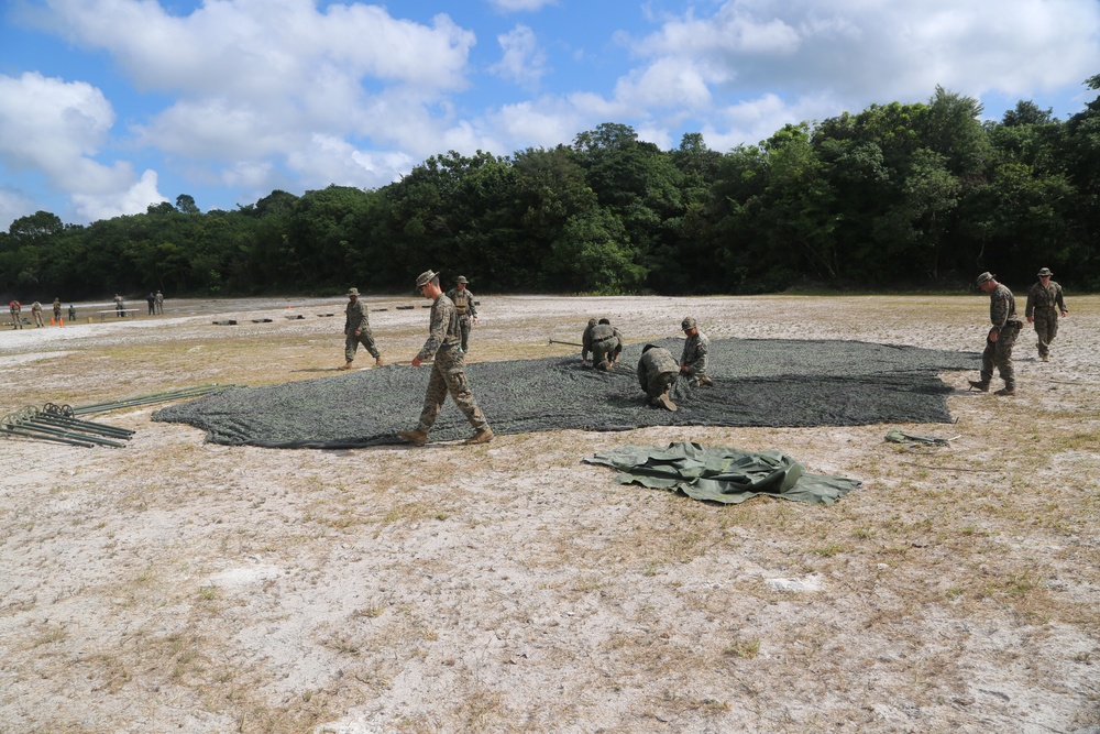 U.S. Marines set up a canopy for live fire drill