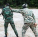 Antigua and Barbuda Merchant Marines assists a Guyana Defence Force soldier during live-fire exercise