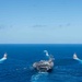 USS Ronald Reagan (CVN 76) sails in formation with HMAS Perth during Talisman Sabre 23