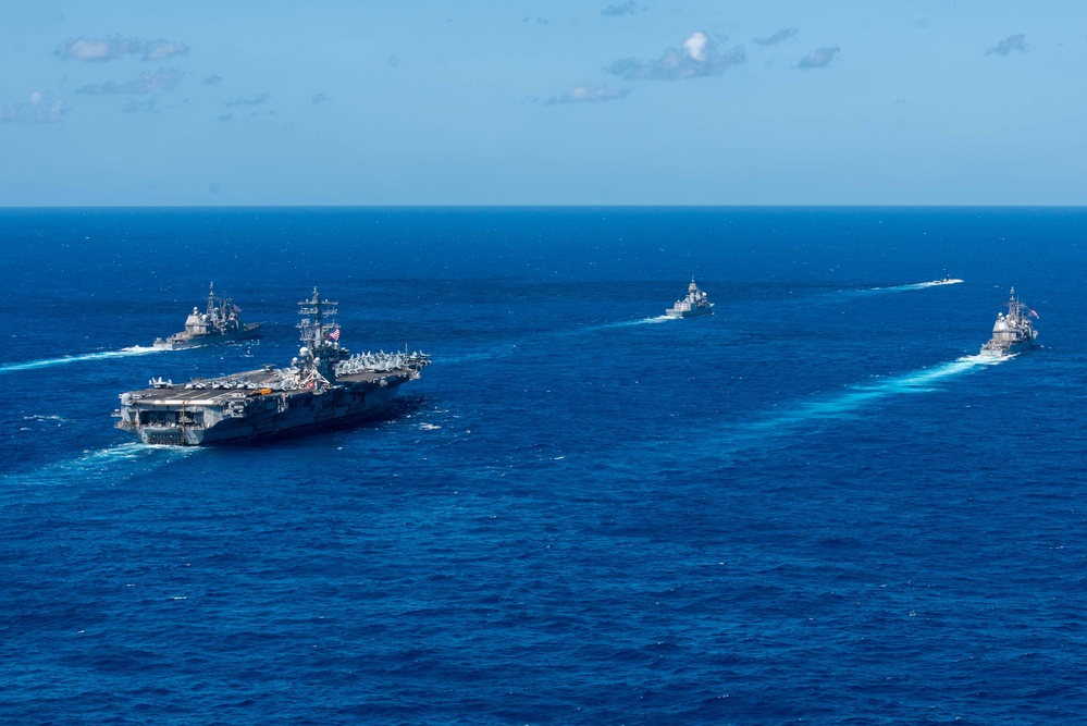 USS Ronald Reagan (CVN 76) sails in formation with HMAS Perth during Talisman Sabre 23