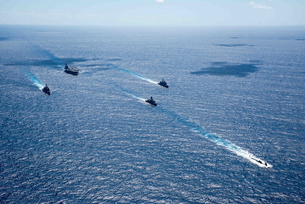 USS Ronald Reagan (CVN 76) sails in formation with HMAS Perth during Talisman Sabre 23