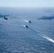 USS Ronald Reagan (CVN 76) sails in formation with HMAS Perth during Talisman Sabre 23